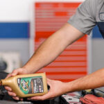 Hyundai service technician performing an oil change